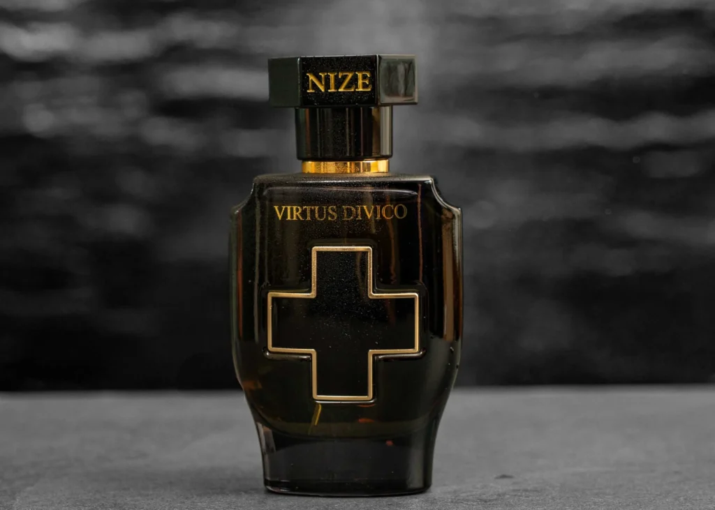 black luxury perfume bottle featuring an elegant cross emblem