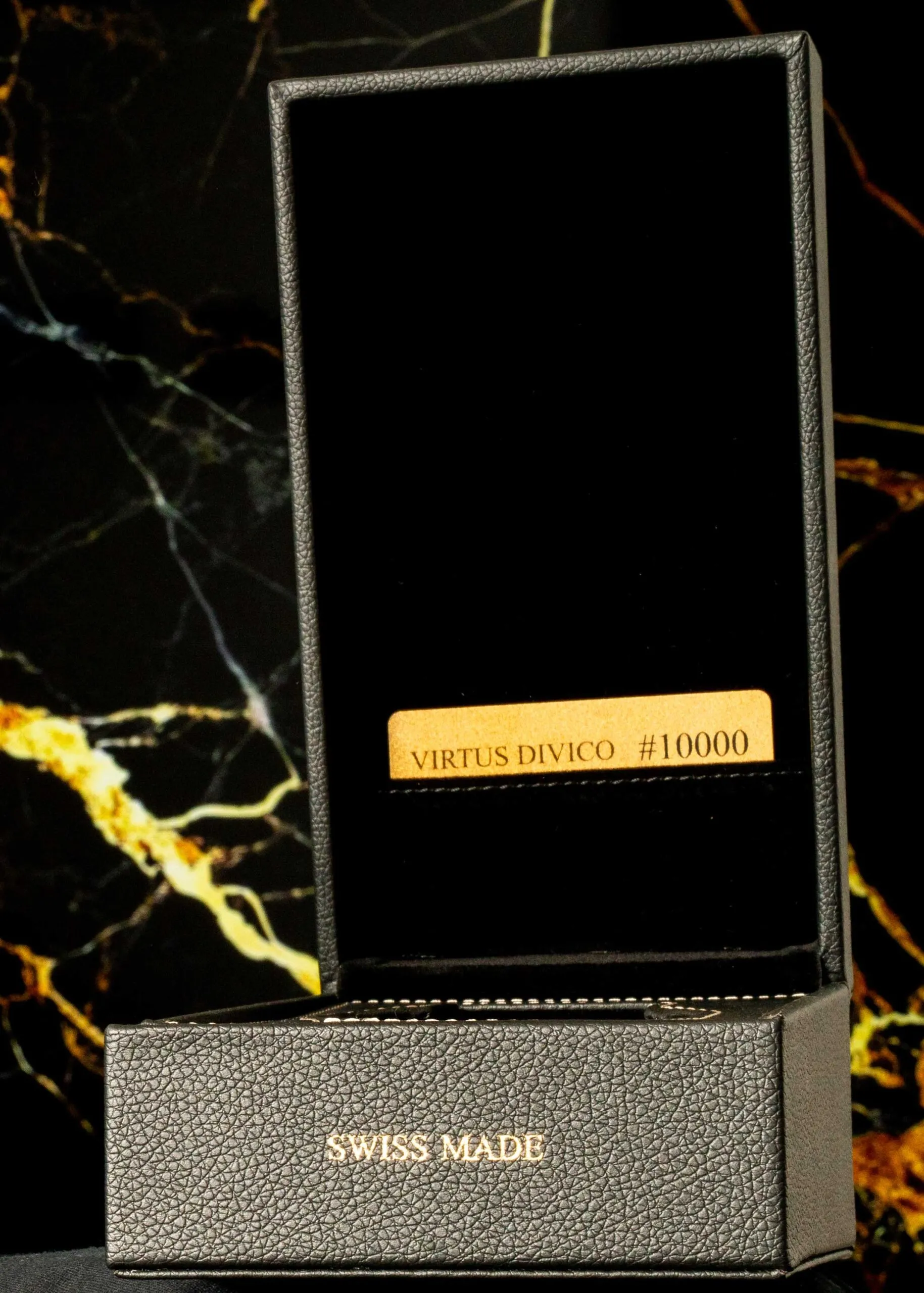 open black leather box with a golden certificate card inside